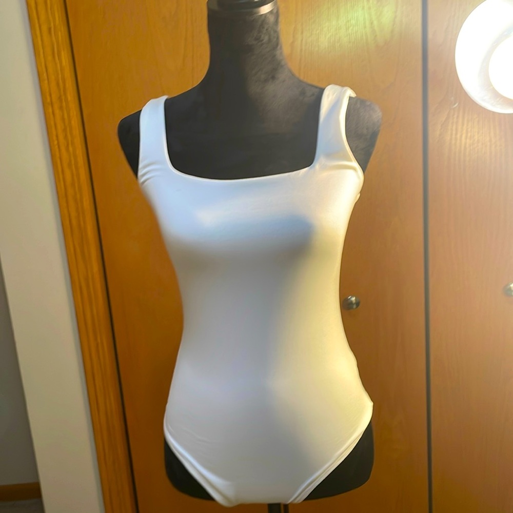 Silky soft,white, size medium, live in the moment bodysuit.